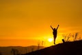 Woman backpacking to watch the sunset.Silhouette,Jumping glad Royalty Free Stock Photo
