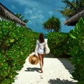 Woman with bag and sun hat going to beach Royalty Free Stock Photo