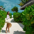 Woman with bag and sun hat going to beach Royalty Free Stock Photo