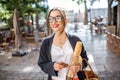 Woman with baguette in the city Royalty Free Stock Photo