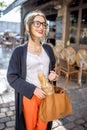 Woman with baguette in the city Royalty Free Stock Photo