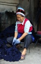 A woman of Bai ethnic minority making batik