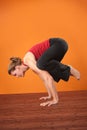 Woman in Bakasana Posture Royalty Free Stock Photo