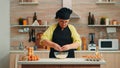 Woman baker cracking eggs