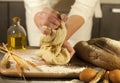 Woman baker hands, kneads dough and making housework making bread, butter, tomato flour Royalty Free Stock Photo