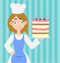 Woman baker holding up a cake