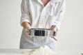 woman baker sift flour cooking meal pastry Royalty Free Stock Photo