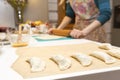 Woman baking pies in her home kitchen