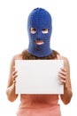 Woman in balaclava holding blank card