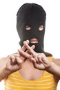 Woman in balaclava showing jail or prison finger Royalty Free Stock Photo