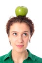 Woman balancing apple on head