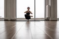 Woman balancing on one leg and keeping hands in namaste Royalty Free Stock Photo