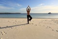 Woman balancing on one leg yoga pose Royalty Free Stock Photo