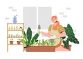 Woman on a balcony or patio growing plants or vegetables in a flowerpot, planting and watering seeds. Concept of urban home