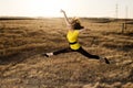 Woman in Balet Jump in a Field