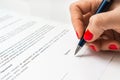 Woman with ballpoint pen signing contract document Royalty Free Stock Photo