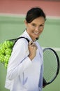 Woman With Balls And Racquet On Tennis Court Royalty Free Stock Photo