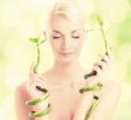 Woman with bamboo plant Royalty Free Stock Photo