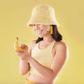 Woman, banana phone texting and studio with smile, communication and eyes sticker art on face. Asian model girl, yellow