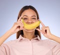 Woman, banana and smile portrait in studio for healthy food, vegan diet and fruit in hands. Face of a happy black person