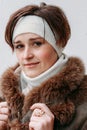 Woman with bandage on head