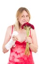 Woman with bandaged hand sniffs at flowers Royalty Free Stock Photo