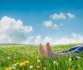 Bare feet on spring grass and flowers Royalty Free Stock Photo