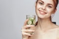 woman with bare shoulders cucumber health drink Fresh