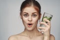 woman with bare shoulders cucumber health drink Fresh