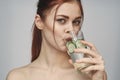 woman with bare shoulders cucumber health drink Fresh