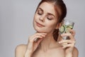 woman with bare shoulders cucumber health drink Fresh