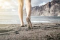 Woman barefoot walking on a beach, summer inspiration Royalty Free Stock Photo