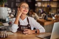 Woman barista felling happy in coffee shop Royalty Free Stock Photo
