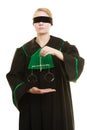 Woman barrister holding scales.