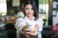 Woman bartender serving customer at coffee shop. Royalty Free Stock Photo