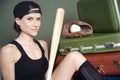 Woman with baseball bat glove ball luggage Royalty Free Stock Photo