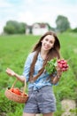 Woman with basket of harvested vegetables Royalty Free Stock Photo