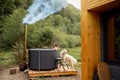 Woman bathing in hot tube, while resting with her dog on nature Royalty Free Stock Photo