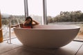 Woman in a modern bath tub Royalty Free Stock Photo
