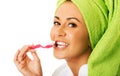 Woman in bathrobe brushing teeth Royalty Free Stock Photo