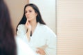 Woman in Bathrobe Cleaning Her Face with Make-up Remover Royalty Free Stock Photo