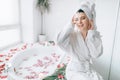 Woman in bathroom decorated with rose petals Royalty Free Stock Photo