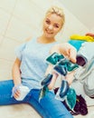 Girl wash laundry with different detergent Royalty Free Stock Photo