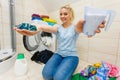 Girl wash laundry with different detergent Royalty Free Stock Photo