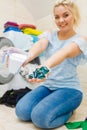 Girl wash laundry with different detergent Royalty Free Stock Photo