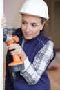 woman in bathroom with drilling machine Royalty Free Stock Photo