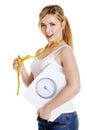 Woman with bathroom scale and measuring tape Royalty Free Stock Photo