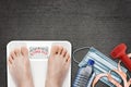 Woman on Bathroom Scale to Stay Fit During COVID-19 Pandemic Lockdown Royalty Free Stock Photo