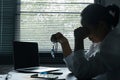 A woman battles depression and stress in her workplace, highlighting the challenges faced by professionals. This image captures