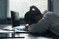 A woman battles depression and stress in her workplace, highlighting the challenges faced by professionals. This image captures